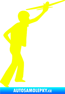 Samolepka Děti silueta 003 pravá kluk s modelem letadla Fluorescentní žlutá